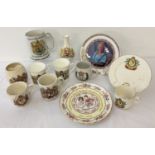 A collection of ceramic commemorative ware mugs, plates and a vase.