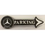 A modern cast iron Mercedes Benz wall hanging plaque in the shape of an arrow.