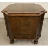 An antique mahogany cellarette with scroll detail feet to front and turned feet to back.