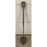 A vintage long handled turf spade.