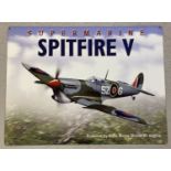 A modern tin plate metal sign of a Supermarine Spitfire V aeroplane.