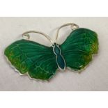 A sterling silver butterfly brooch with enamelled detail to body and wings.