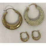 2 pairs of hoop style earrings. A larger pair set with clear stones to one side.