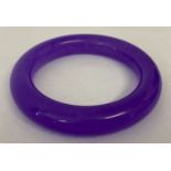 A lavender jade bangle.