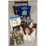 A collection of vintage rock and pop LP records.