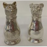 A silver plated novelty cruet with shakers in the form of cat and dog heads.