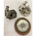 3 assorted compasses.