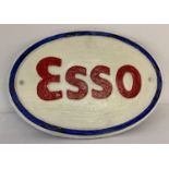 An oval painted cast iron "Esso" wall hanging plaque.