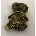 A brass novelty vesta case in the shape of an Ally Sloper style caricature head.