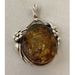A 925 silver mounted Art Nouveau style amber pendant.