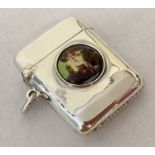 A 925 silver vesta case with circular ceramic plaque featuring a nude female.