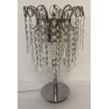 A chrome and crystal drop, chandelier style table lamp.