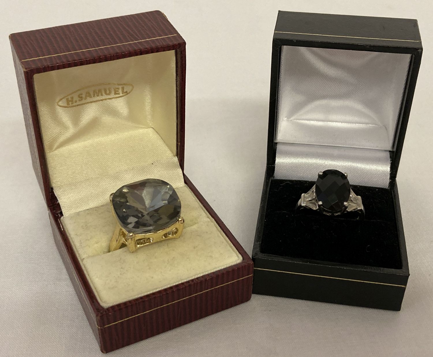 2 dress rings. A 925 silver ring with multi faceted black stone & pierced work detail to mount.