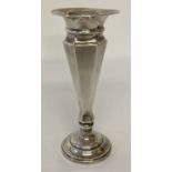 A hallmarked silver bud vase with hexagonal shaped body and weighted base.