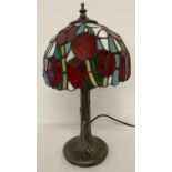 A small Tiffany style table lamp with tulip design to lampshade.