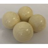 4 white billiard balls, with highly polished finish.