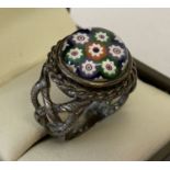 A vintage Silver dress ring set with a round piece of Millefiori glass.