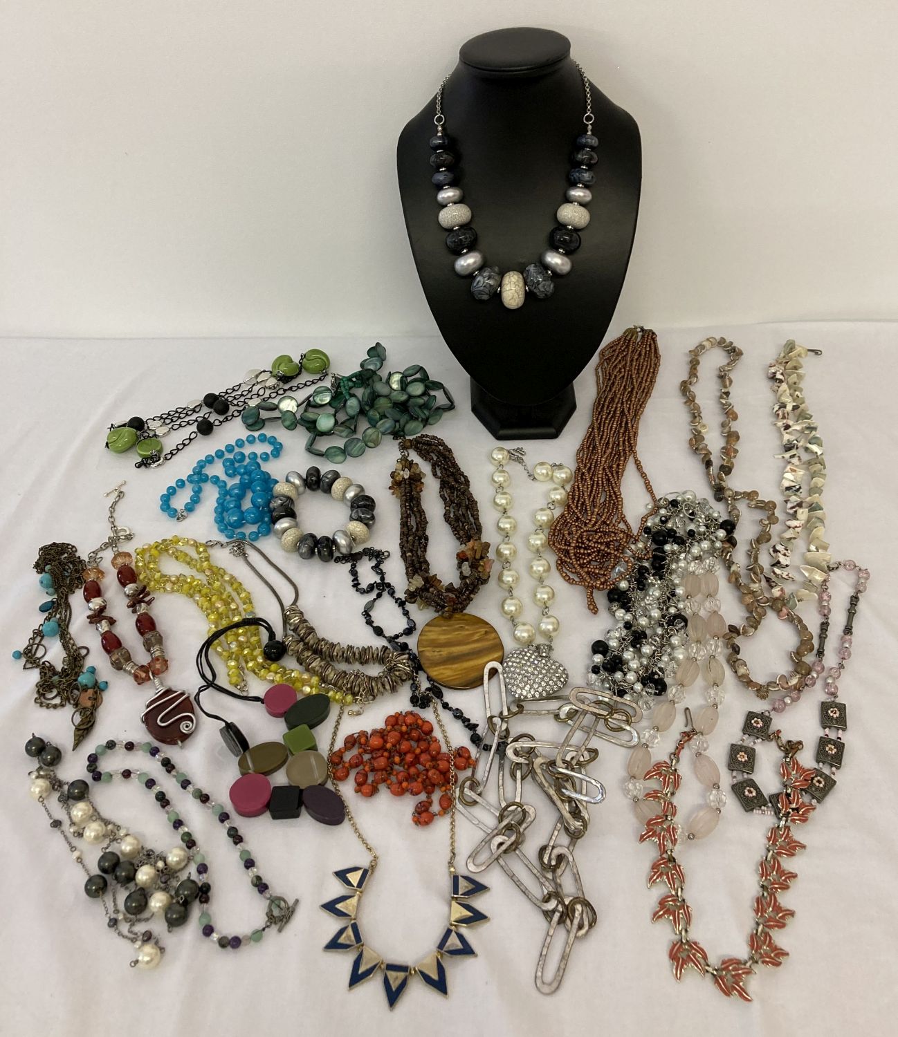 A collection of costume jewellery statement necklaces in varying lengths and styles.