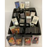 A collection of vintage rock and pop music cassette tapes.