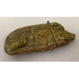 A small brass novelty vesta case in the form of a pig.