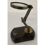 A wooden based magnifying glass on adjustable stand.