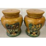 A pair of antique majolica garden stools in brown and green glaze.