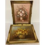 2 gilt framed oil on canvas paintings of still life flowers. Both pictures signed to bottom left.