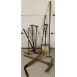 9 vintage garden tools. To include lawn edging shears, a shovel a/f, pick axe and hoe.