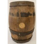 A vintage oak barrel with 3 metal hoops and original fixing pins.