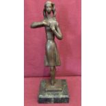 An abstract style bronze figure in the form of a ballerina.