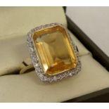 A 9ct gold citrine and diamond dress ring by Luke Stockley, London.