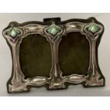 A small Art Nouveau style freestanding double picture frame with enamelled detail.