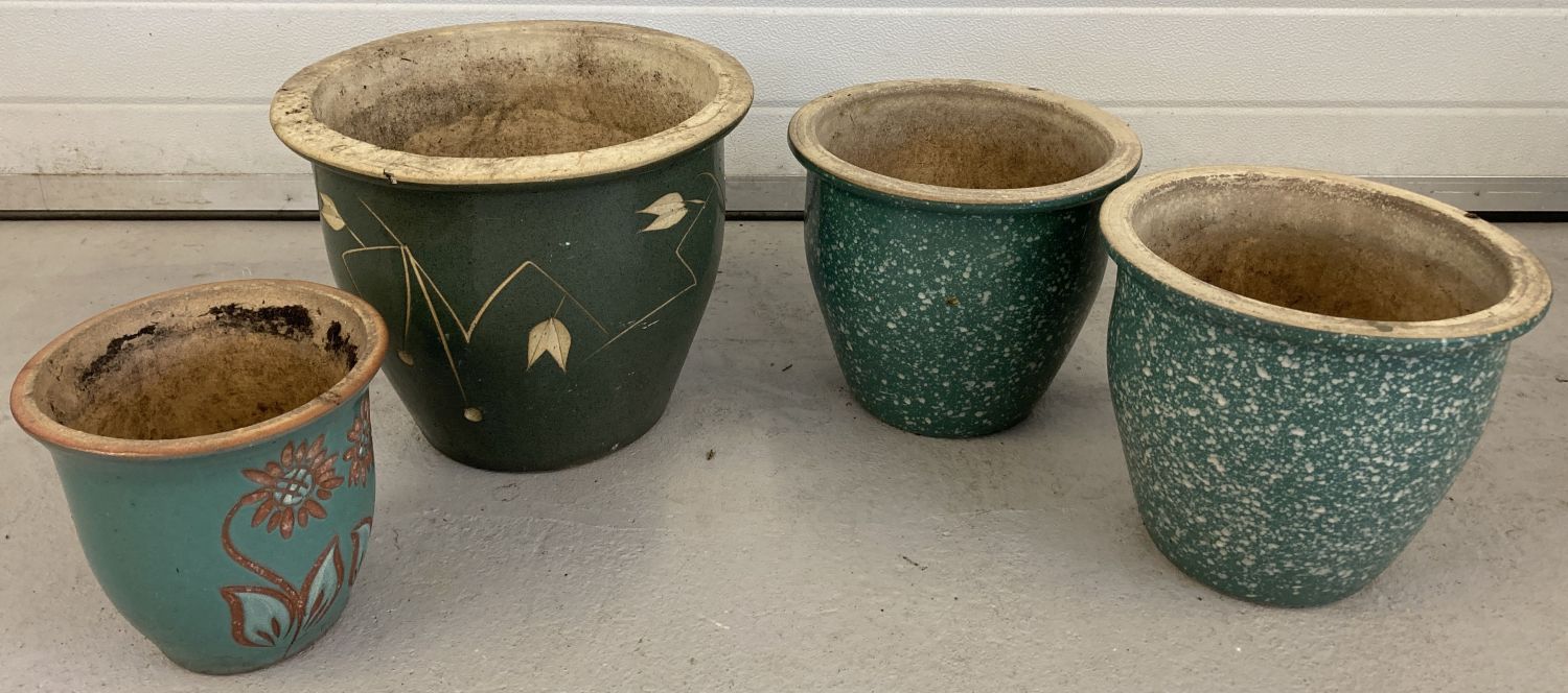 A collection of 4 ceramic garden pots with green glaze finish.