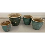 A collection of 4 ceramic garden pots with green glaze finish.