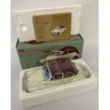 A boxed limited edition 1:12 scale die cast model of a 1956 Morris Minor 1000 Tourer by Sun Star.