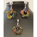 A Millefiori glass flower shaped pendant and matching earrings sets.
