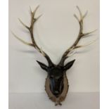A large modern stags head wall decoration, made from resin.