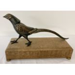An Art Deco painted spelter figurine of a pheasant, mounted on wooden base.