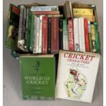 A box of books relating to cricket.