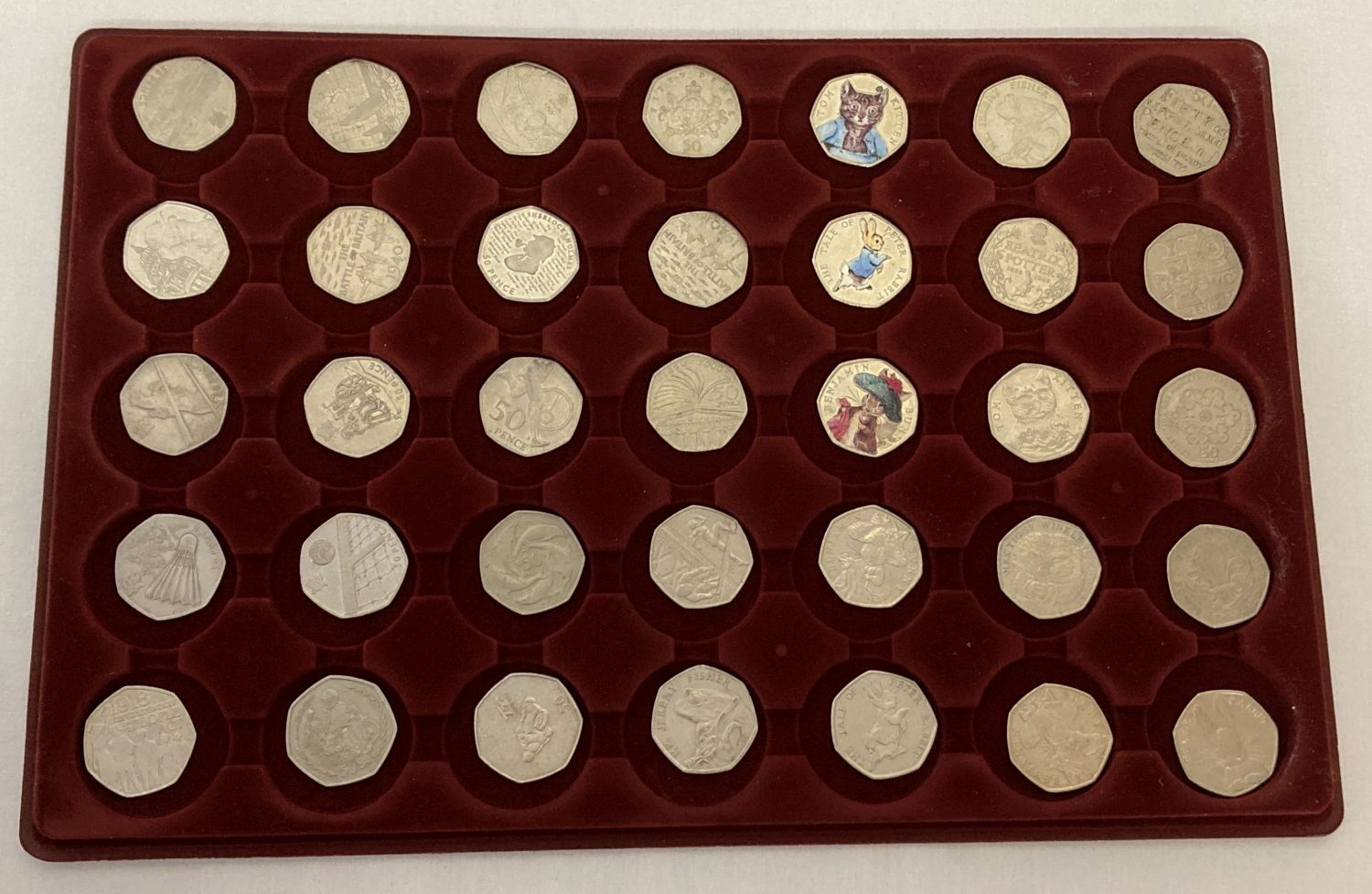 A tray of 35 collectable 50p coins. To include 12 different Beatrix Potter.