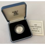 A boxed English 925 silver £1 coin dated 1989 with COA.