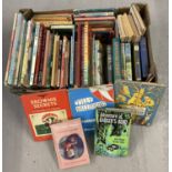 A box of assorted vintage children's books.