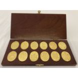 A collection of 12 "The Arms Of The Prince And Princess Of Wales" gold plated silver ingots.