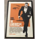 A framed and glazed film poster of "The American" 2010 starring George Clooney by Focus features.