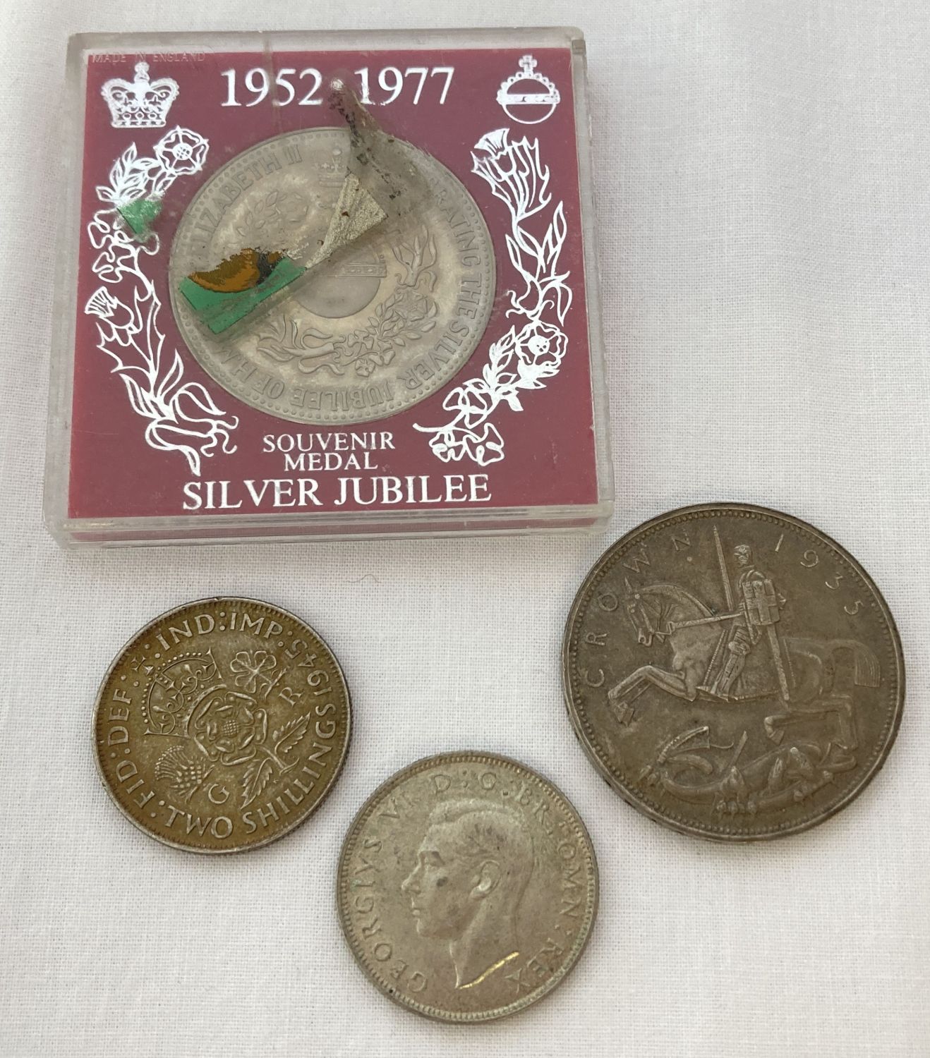 4 vintage coins. A 1935 "Rocking Horse" George V crown coin.