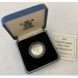 A boxed Scottish 925 silver £1 coin dated 1992 with COA.