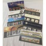 A collection of 8 Royal Mail collectors stamp sets with information cards.