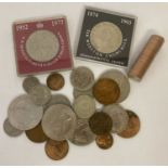 A small collection of British and foreign coins. To include crowns & a sealed roll of ½ pence coins.