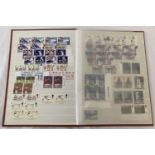 A Wenca stamp album containing British commemorative and special issue stamps.