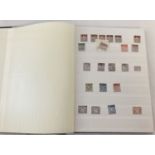 A Lighthouse stamp stock book containing British and world stamps.